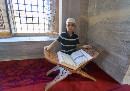 ISTANBUL, TURKEY - JULY 1: EdirnekapÃÂ± Mihrimah Sultan Mosque in reading Koran child, 1 July 2016 in Istanbul Turkey. The Muslims who have made a tradition of reading Koran the month of Ramadan.のeditorial素材