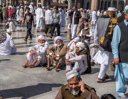 MEDINA, KINGDOM OF SAUDI ARABIA (KSA) - FEB 02: Pilgrims pray outside Masjid Nabawi after morning prayer February 02, 2017 in Medina, KSA. The mosque is the second holiest mosque in Islam.のeditorial素材