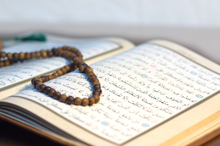 Made of wood, rosary on the Qur'an Kerimの写真素材