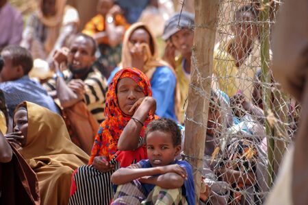 DADAAB, SOMALIA - AUGUST 8: Unidentified women, men and babies live in the Dadaab refugee camp...