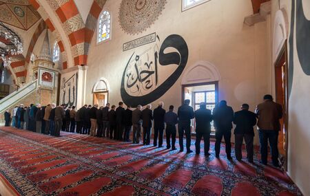 EDIRNE - TURKEY, MARC 9: Undefined muslims praying in Edirne Old Mosque on March 9, 2019. The Old Mosque is an early 15th century Ottoman mosque in Edirne, Turkeyのeditorial素材