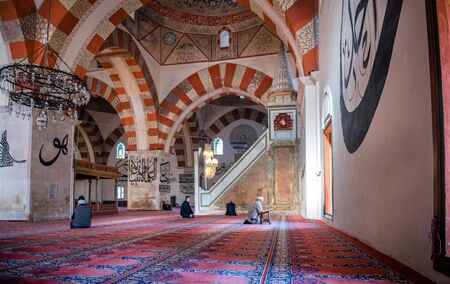 EDIRNE - TURKEY, MARC 9: Undefined muslims praying in Edirne Old Mosque on March 9, 2019. The Old Mosque is an early 15th century Ottoman mosque in Edirne, Turkeyのeditorial素材