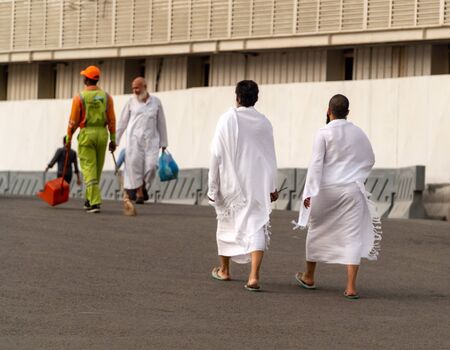 MECCA, SAUDI ARABIA - JUNE 30: Muslim wearing ihram clothes and ready for Hajj on June 30, 2019 in Mecca, Saudi Arabia. Muslims all around the world face the Kaaba during prayer time.のeditorial素材