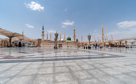 MEDINA, SAUDI ARABIA - JUNE 25: Muslims marching in front of the mosque of the Prophet Muhammad on...