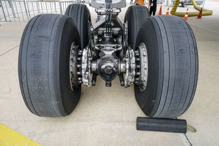 Close-up of the chassis of the passenger aircraft. The plane in the airport terminal.