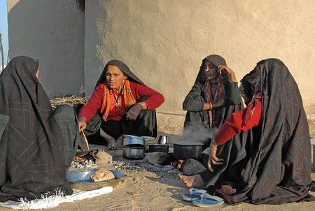 Tradtional Dressed women with making food at kutch village in indiaのeditorial素材