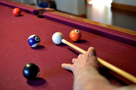 Pool billiard cue stick ready to hit balls