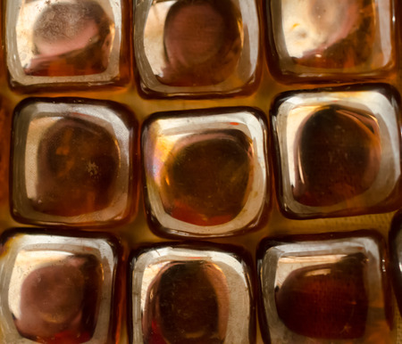 Shiny gold brown abstract background or backdrop. Reflections of light on textured pattern.の写真素材