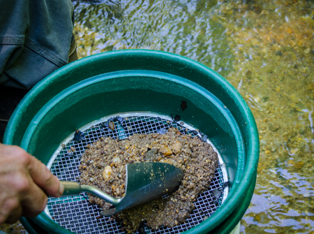 Gold panning and gem mining. Classifier used to sift material. Tools used for prospecting and panning for gold. Fun and adventure in this recreational activity.の写真素材