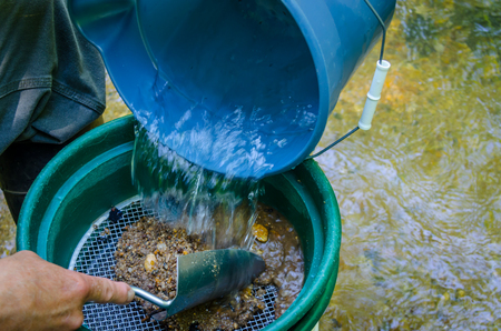 Gold panning and gem mining. Classifier used to sift material. Tools used for prospecting and panning for gold. Fun and adventure in this recreational activity.の写真素材