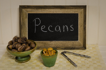 Pecan nuts, in shell and cracked.  Healthy nutritious delicious organic fiber snack.  Fresh autumn...