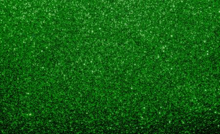 Emerald green, glitter, sparkle and shine abstract background. Excellent backdrop for festive Holiday's, including Christmas, New Year and St. Patrick Day.  Deep Rich vibrant dark green color.の写真素材