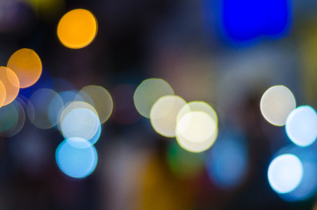 Defocused urban abstract texture, bokeh of city lights in the background with blurring lights