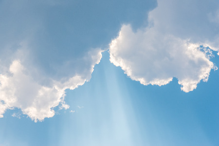 Beautiful background bright sun shines through clouds, light rays and other atmospheric effect