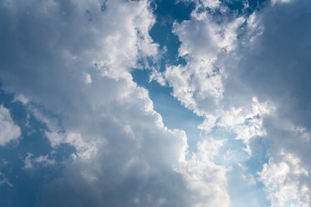 Beautiful background bright sun shines through clouds, light rays and other atmospheric effectの写真素材