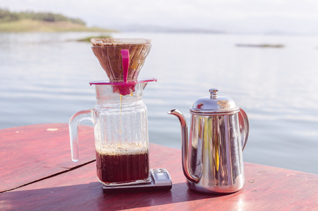 Hand drip coffee set, metal drip glass pitcher in vintage toneの写真素材