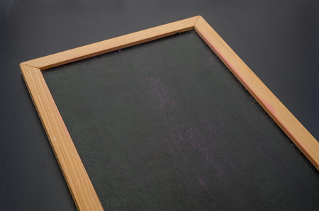 Hand writing with a colorful chalk on blackboard in lowkey tone