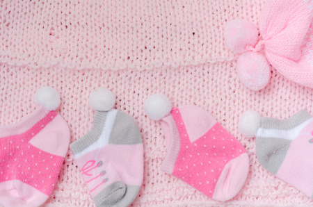 Pink knit hat and socks gift set for a newborn baby girlの写真素材