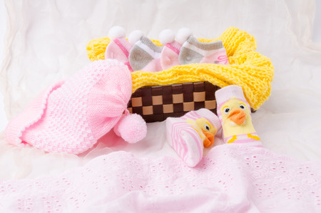 Pink knit hat and socks gift set for a newborn baby girlの写真素材