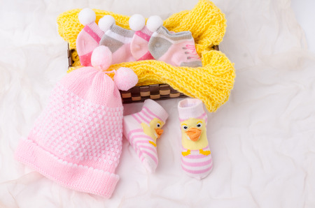 Pink knit hat and socks gift set for a newborn baby girlの写真素材