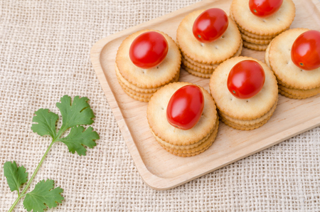 crackers biscuits on burlap sack backgroundの写真素材