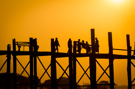 Silhouette wooden bridge during golden light of sunset