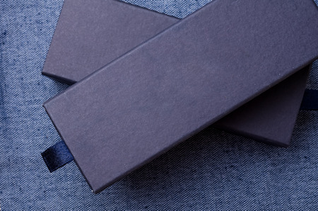 Close up of blue boxes on blue fabric backgroundの写真素材