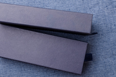 Close up of blue boxes on blue fabric background