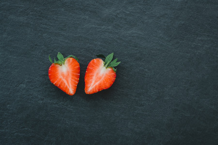 Fresh strawberry on black stone backgroundの写真素材