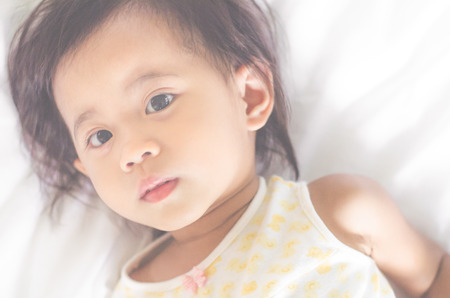 Close up of cute asian baby girl at home