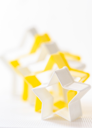 Cloase up star shaped pastry cutter on a white background