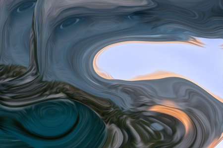Beautiful abstraction of liquid paints in slow blending flow mixing together gentlyの写真素材