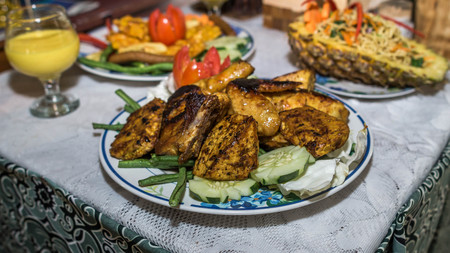 Charcoal Grilled chicken served with Tomato and Chili Sauce. Indonesian foodの写真素材