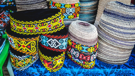 Traditional head wear / hat made from rattan displayed in front on souvenir shop in Samarinda, Indonesiaの写真素材