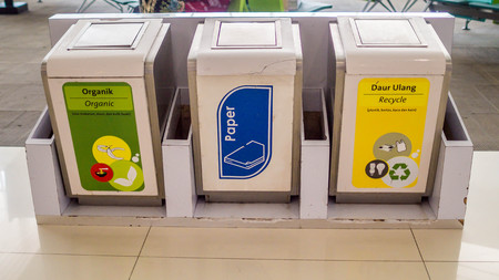 trash bin for different types of garbage. trash recycle bin. people must sort their trash before throw it to the bin.のeditorial素材