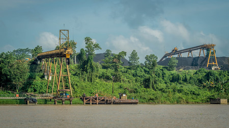 Coal stockpile on upper Mahakam riverbank, Indonesia