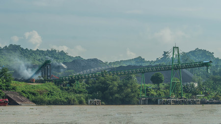 Coal stockpile on upper Mahakam riverbank, Indonesia