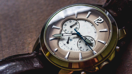 closeup of watch with chronometer on wooden backgroundの写真素材