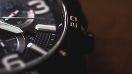 closeup of watch with chronometer on wooden backgroundの写真素材