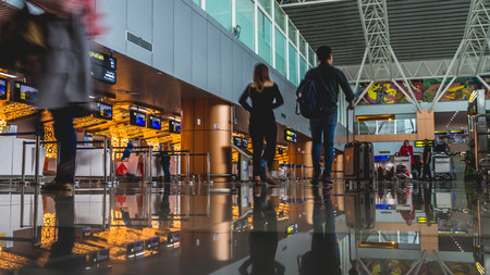 Pontianak, Kalimantan Barat / Indonesia - 5/14/2018: The activity in the airport terminal building, passenger with luggage trolley in front of check-in counter deskのeditorial素材