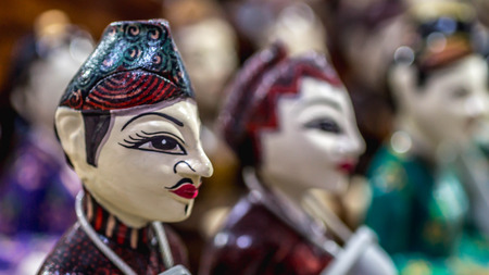 wooden statue of Javanese groom and bride called "Loro Blonyo" sold as souvenir for the touristのeditorial素材
