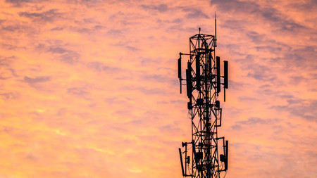digital communication tower with beautiful sky as the background at dawnの写真素材