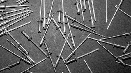 metal blind rivet. construction and industrial background