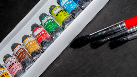 water paint set in the box with different size of paintbrushes. art backgroundの写真素材