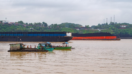 traditional method of sand mining at Mahakam River, Smarinda, Indonesiaの写真素材