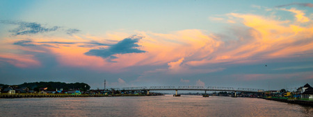 Kapuas Bridge with beautiful sunset Pontianak, Indonesiaの写真素材