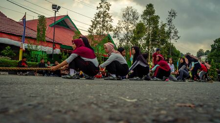 Samarinda, Indonesia - 17 August 2019: Female students play tug of war to commemorate Independence day of Indonesiaのeditorial素材