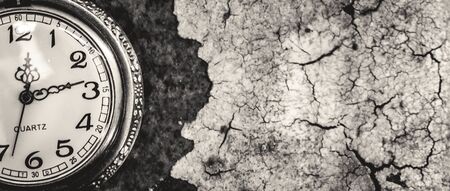 Vintage pocket watch showing time with textured background. concept of timeの写真素材