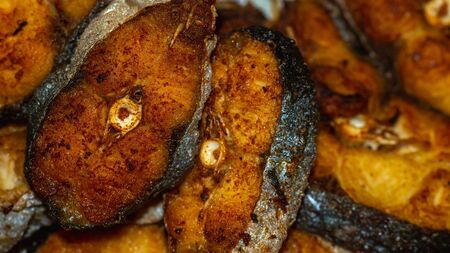 Slices of fried Pangasius fishの写真素材
