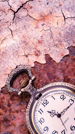 Vintage pocket watch showing time with textured background. concept of timeの写真素材